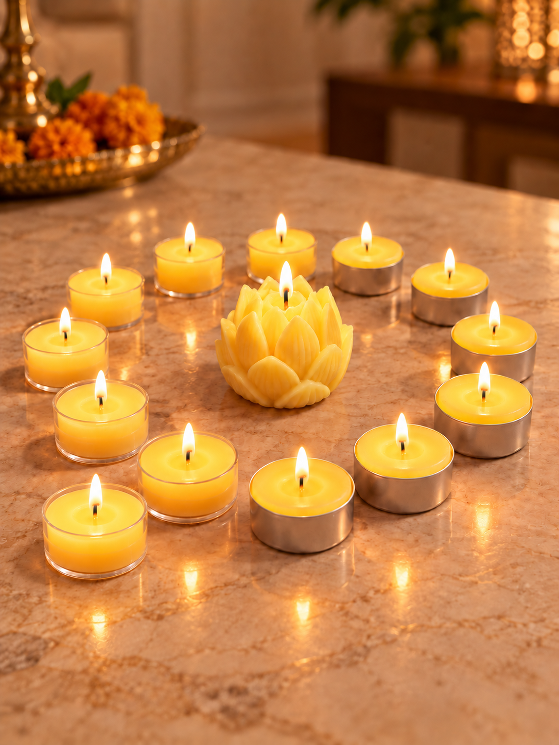 Golden beeswax lotus candle surrounded by 12 clear-cup tea lights